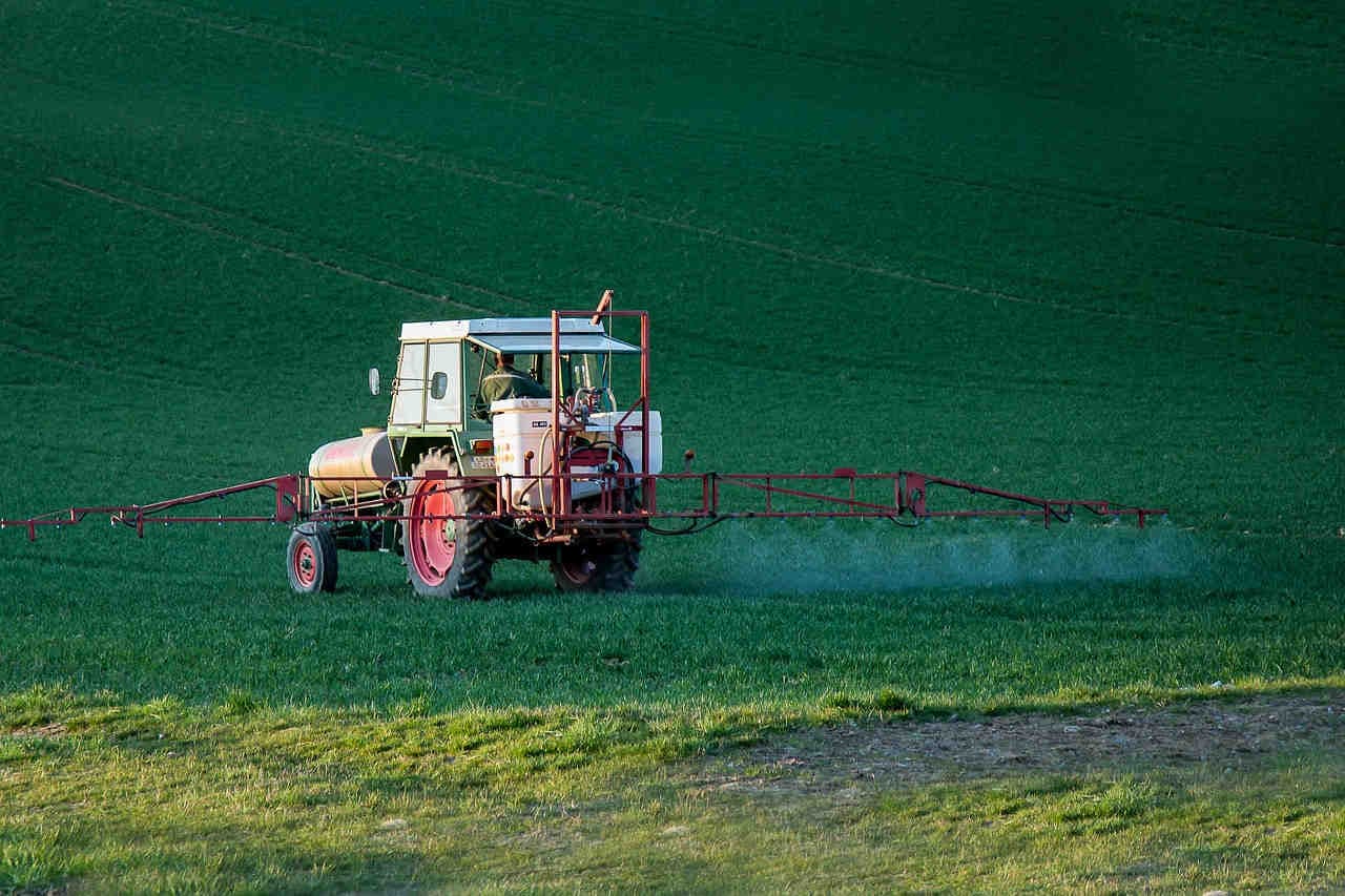 Spray mist of pesticides