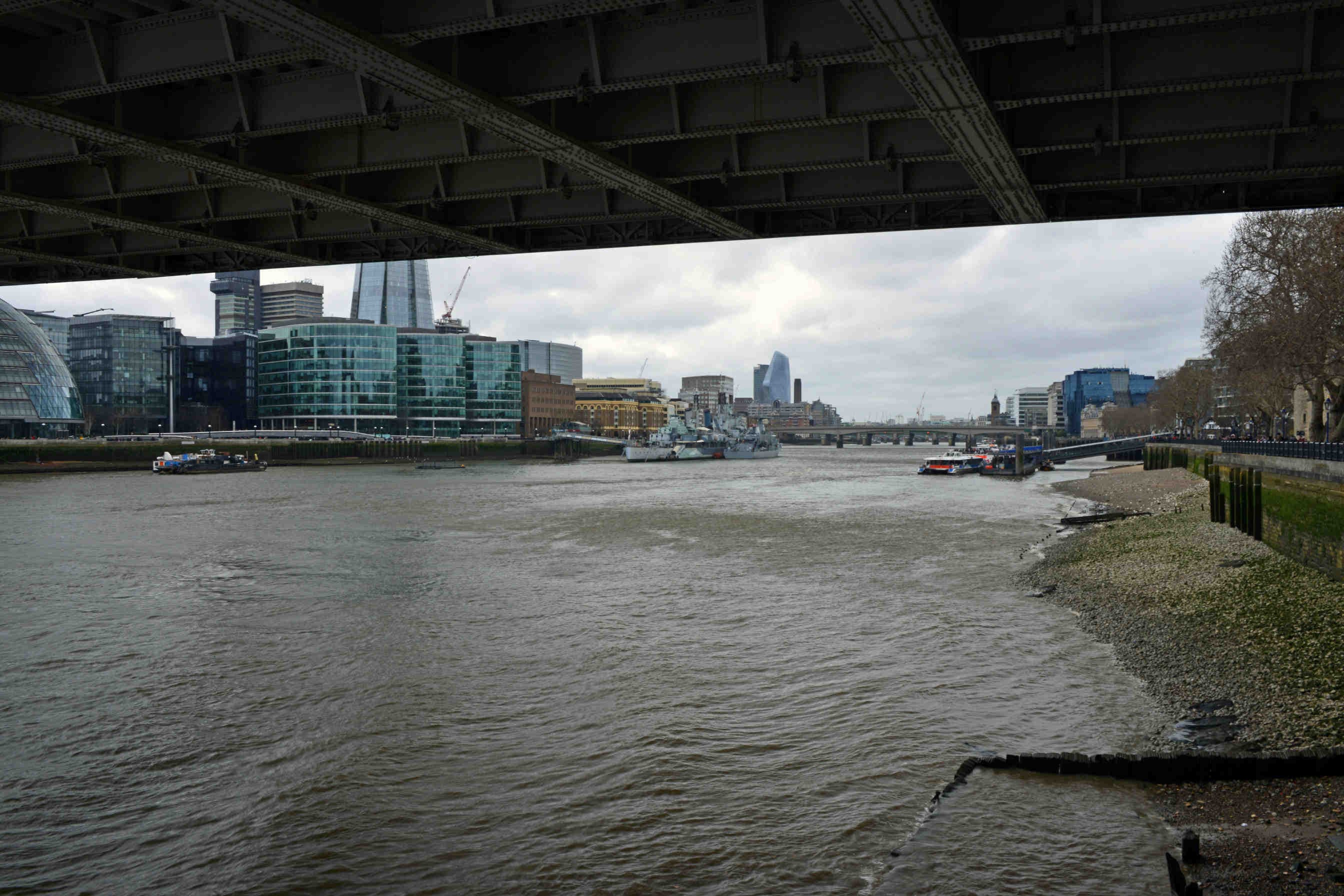 A view of the thames from under a bridge
